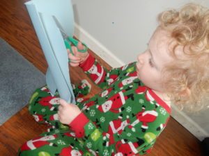 When teaching a child how to hold scissors, make sure you teach the child to keep his thumb up.