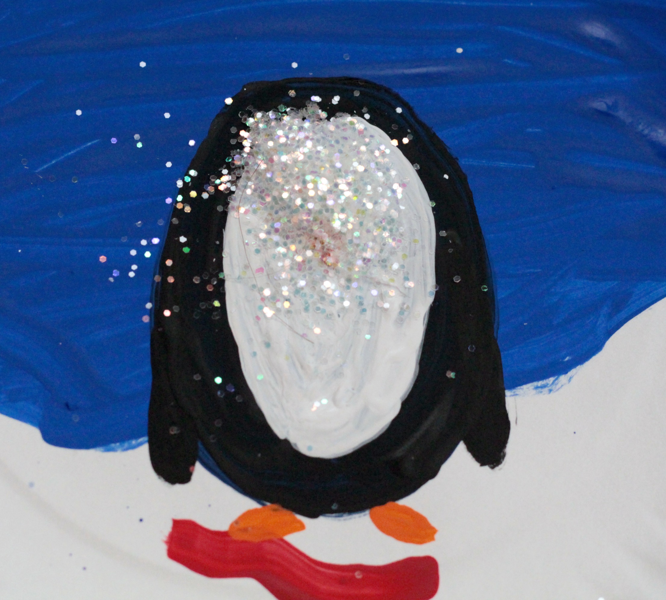 Instead of playing with dangerous and messy snow globes, kids can make their own paper plate penguin snow globe using a paper plate and some craft supplies!